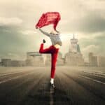 woman-leaping-holding-a-red-scarlet-a-red-scarf-for-joy-talking-about-survive-menopause