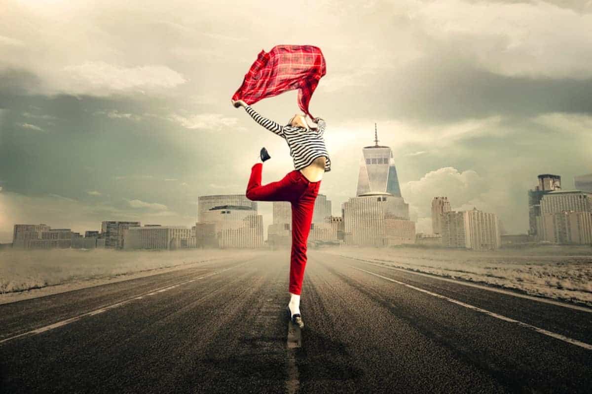 woman-leaping-holding-a-red-scarlet-a-red-scarf-for-joy-talking-about-survive-menopause