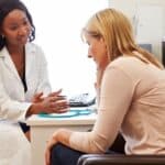 woman-talking-to-female-doctor-about-menopause