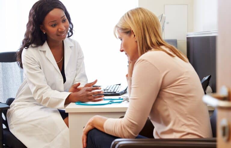 woman-talking-to-female-doctor-about-menopause