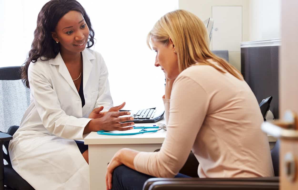 woman-talking-to-female-doctor-about-menopause