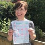 Elizabeth Carr-Ellis holding a KnowYourMenopause poster